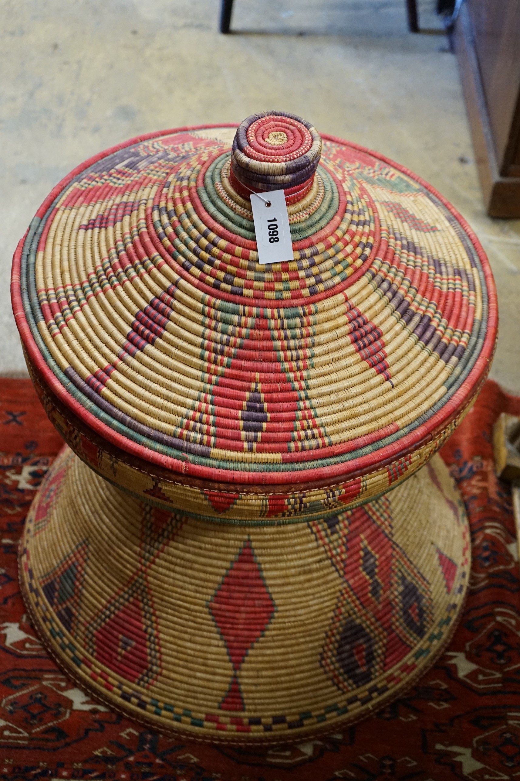 A large African woven basket, height 76cm